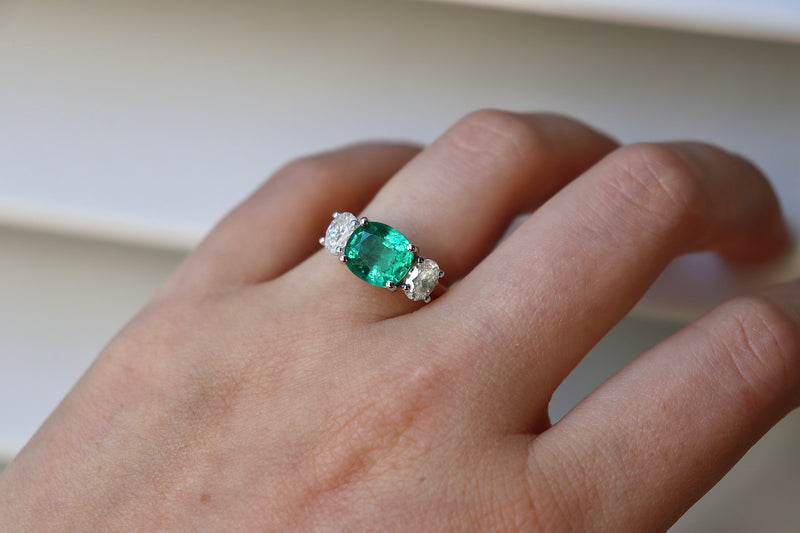 18ct Yellow and White Gold East West Emerald and Oval Diamond Ring