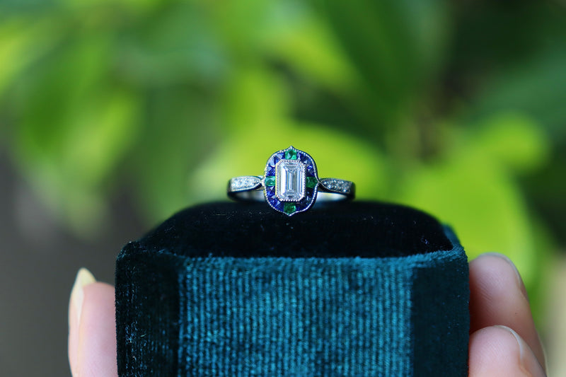 Platinum Emerald Cut Diamond with Sapphire and Emerald Art Deco Style Halo