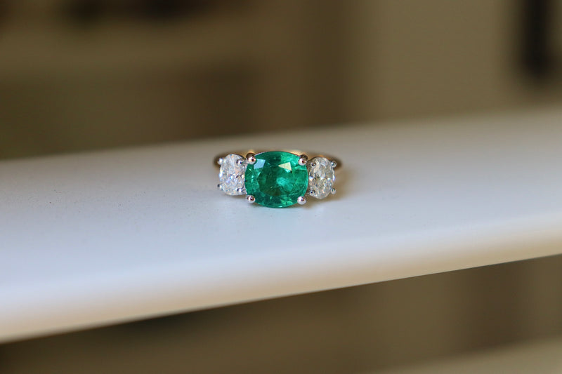 18ct Yellow and White Gold East West Emerald and Oval Diamond Ring