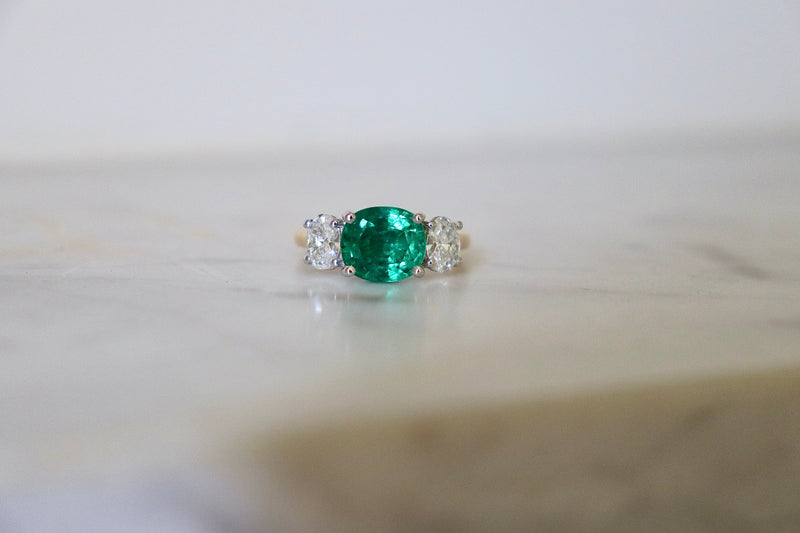 18ct Yellow and White Gold East West Emerald and Oval Diamond Ring