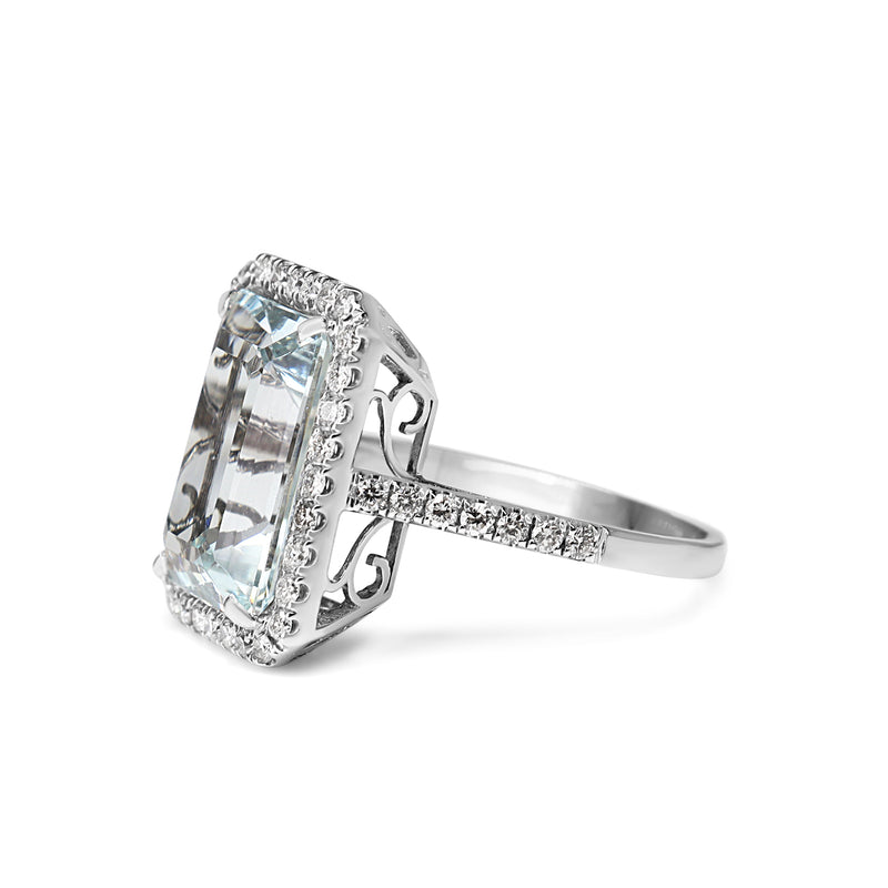 18ct White Gold Emerald Cut Aquamarine and Diamond Halo Ring