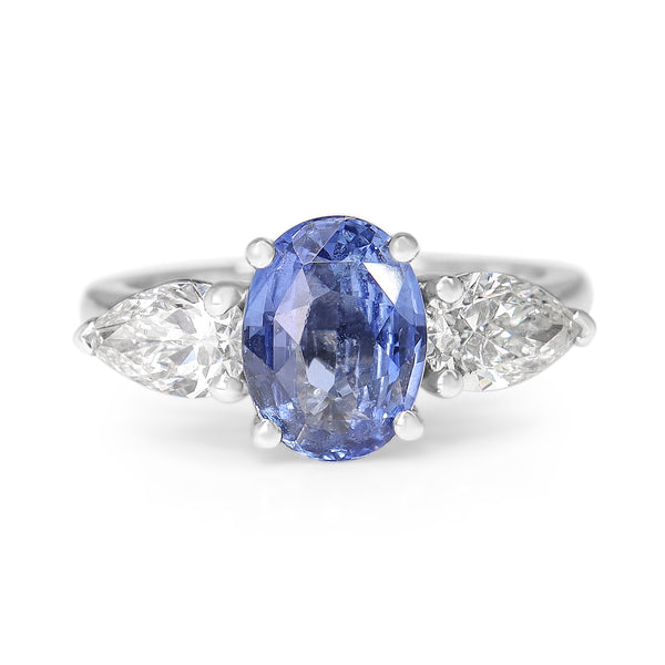 18ct White Gold Cornflower Blue Oval Sapphire and Pear Diamond 3 Stone Ring