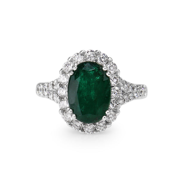 18ct White Gold Emerald and Diamond Halo Ring