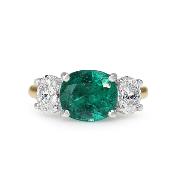 18ct Yellow and White Gold East West Emerald and Oval Diamond Ring