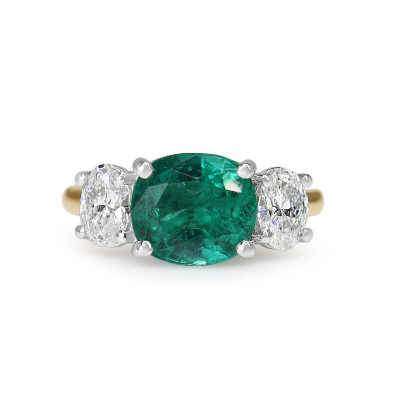 18ct Yellow and White Gold East West Emerald and Oval Diamond Ring