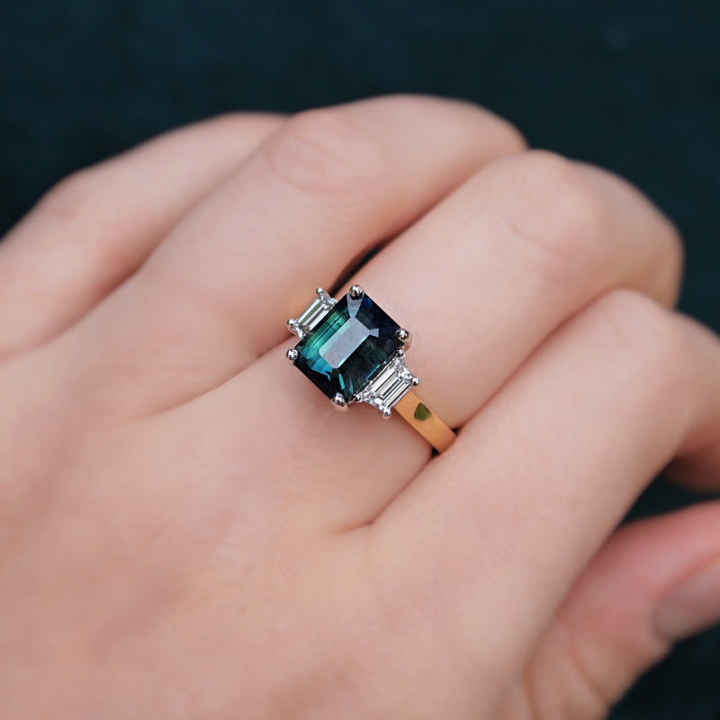 18ct Yellow and White Gold Teal/Parti Sapphire and Tapered Baguette Diamond 3 Stone Ring