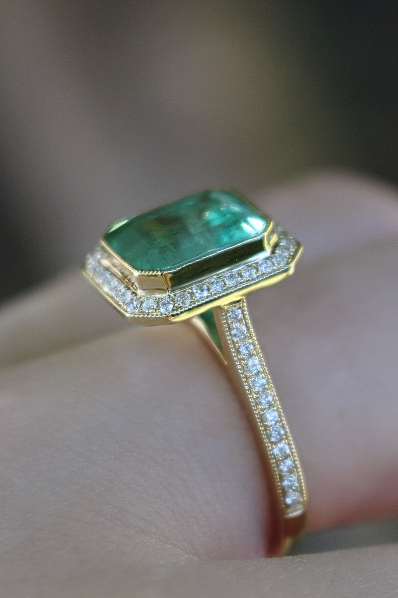 18ct Yellow Gold Emerald and Diamond Halo Ring