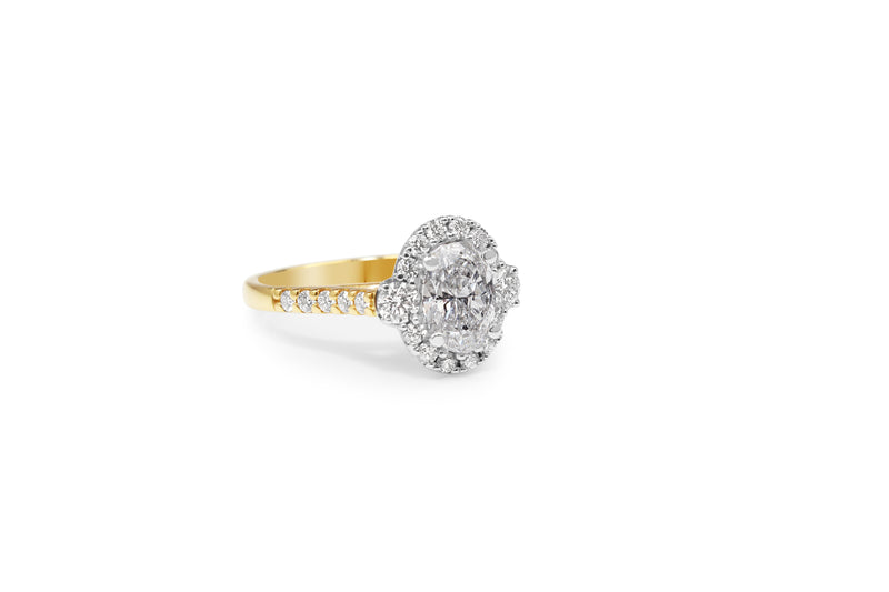 18ct Yellow and White Gold Oval Halo Diamond Ring