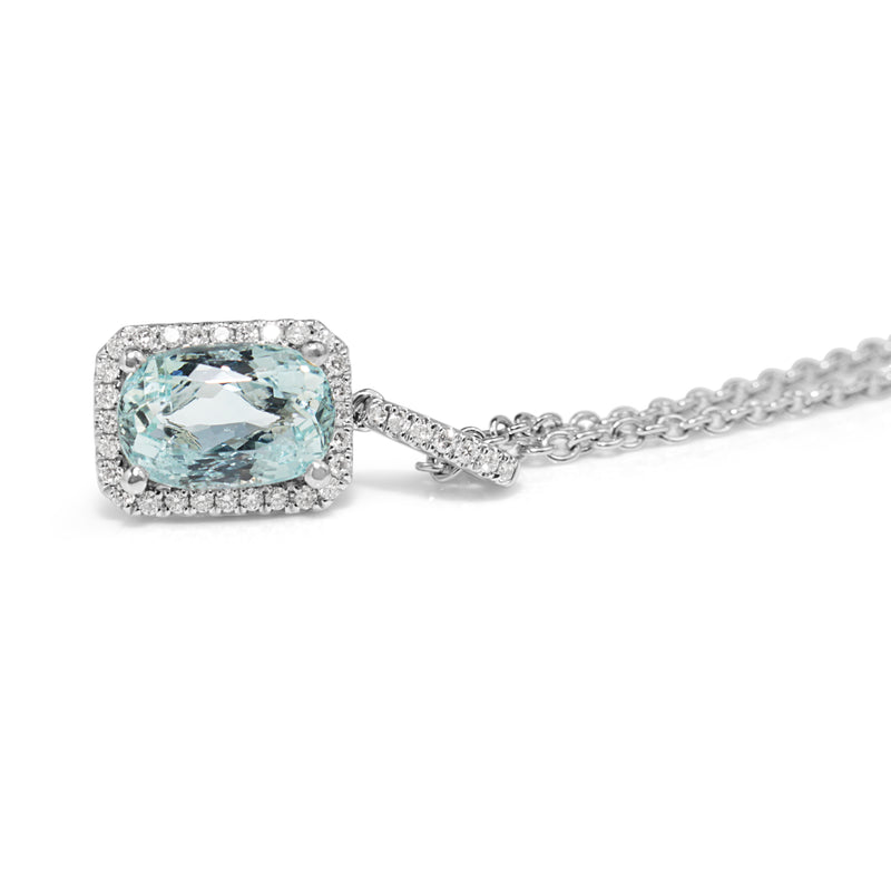 18ct White Gold Aquamarine and Diamond Halo Pendant