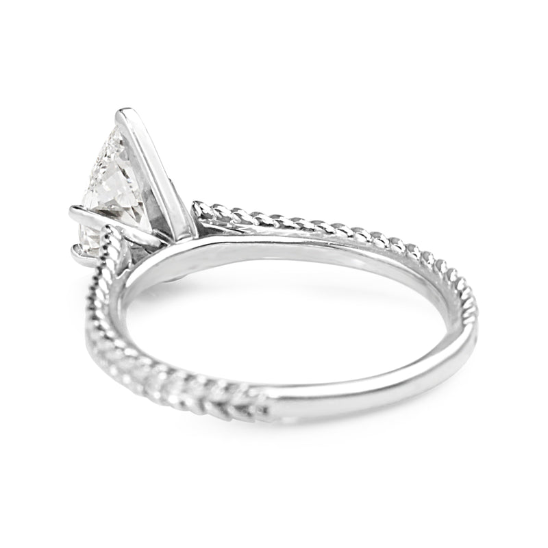 Platinum Pear Diamond Solitaire Ring with Engraved Band